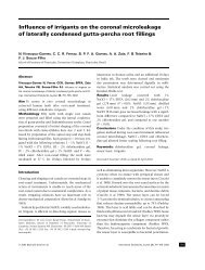 Influence of irrigants on the coronal microleakage of laterally ...