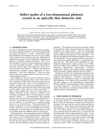 Defect modes of a two-dimensional photonic crystal in an optically ...