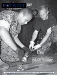 TIE–DOWN – Marine Sgt. Cliff Higby, left, ties down cargo inside a ...