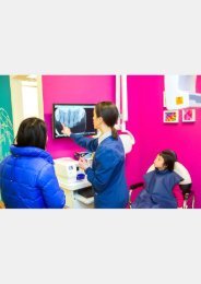 Pediatric dentist Dr. Ciano explaining the dental x-ray results to her patient's parent