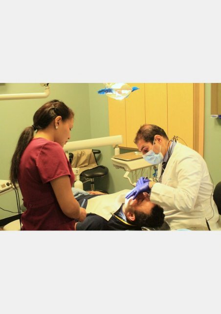 Dr. Uthman performing periodontal procedure