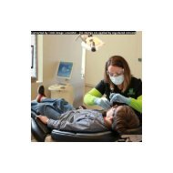 Dental Hygienist at Harmony Dental examining patient