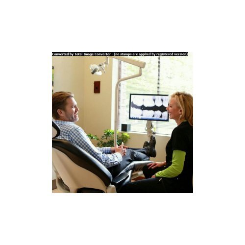 Dental hygienist at Harmony Dental with dental implant patient