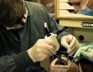Dr. Jason Keefe performing periodontal therapy at his Spokane clinic 5 Mile Smiles