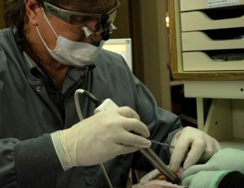 Spokane dentist Dr. Jason Keefe of 5 Mile Smiles performing dental implants procedure