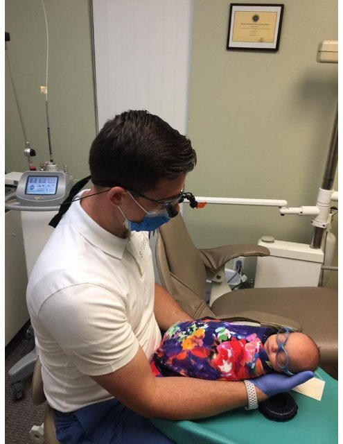 Dr Warcup with pediatric patient at North Texas Smiles Pediatric Dentistry & Orthodontics Fort Worth TX